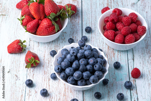 Berries  summer fruits on a wooden table. Healthy lifestyle concept. Selective focus