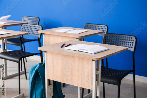 Modern school desks near co...