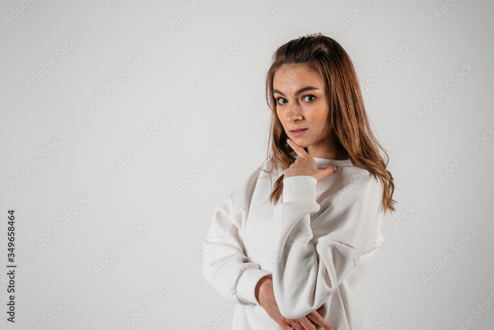 A beautiful young beautiful woman, isolated on white background, looking to the camera confidently A beautiful young beautiful woman, isolated on white background, looking to the camera confidently