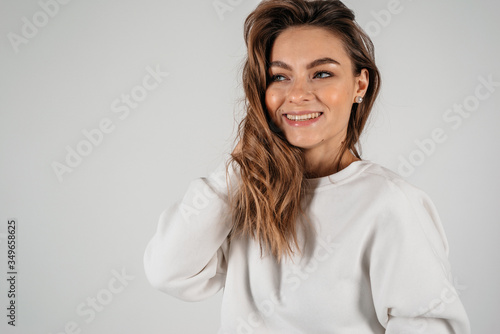 Pretty excited woman happy smile, young attractive girl looking at camera toothy smiling isolated over white background