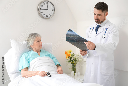 Male doctor working with el...