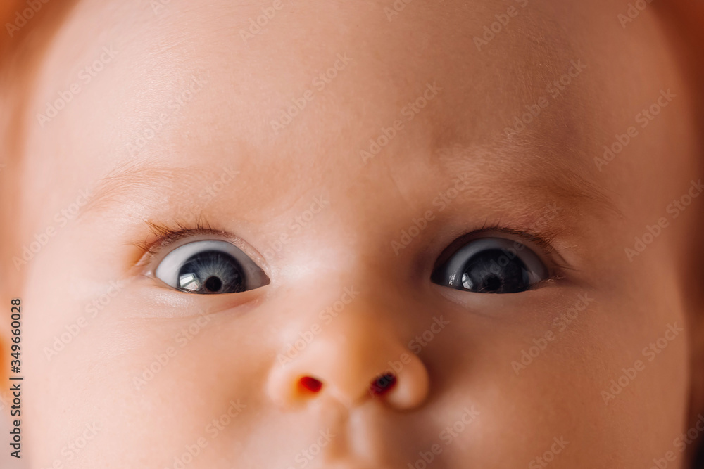 Baby eyes close up macro shooting. Newborn headshot Baby eyes close up macro shooting. Newborn headshot