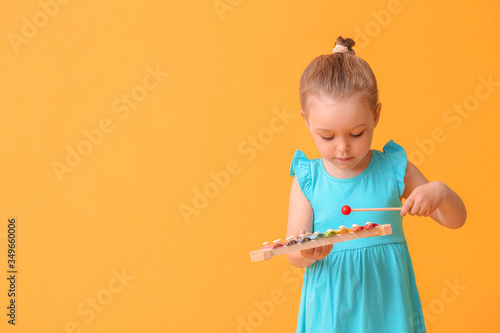 Little girl with toy on col...