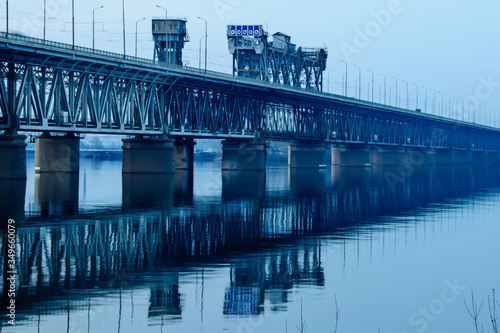 Old metal bridge across the Dneper River in Eastern Europe, Ukraine. Beautiful