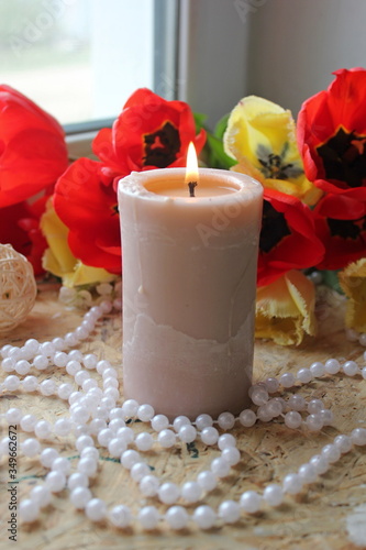 candles and flowers. candles and rose petals. candle on wooden background