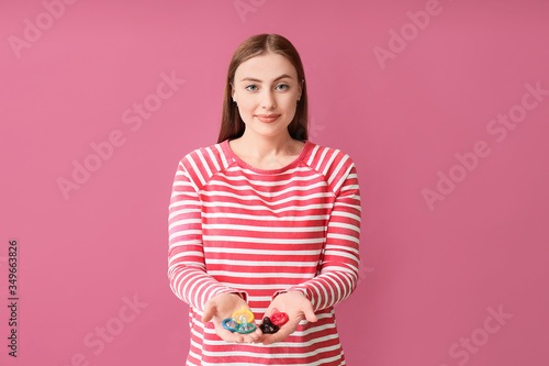 Young woman with condoms on...