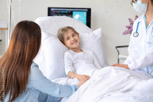 Mother visiting her little daughter in hospital