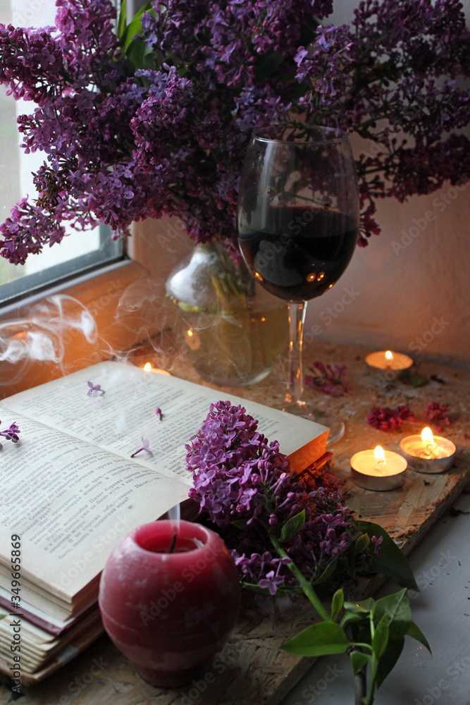 still life with flowers and wine. Still life with lilac and wine. Romantic atmosphere. lilac bouquet