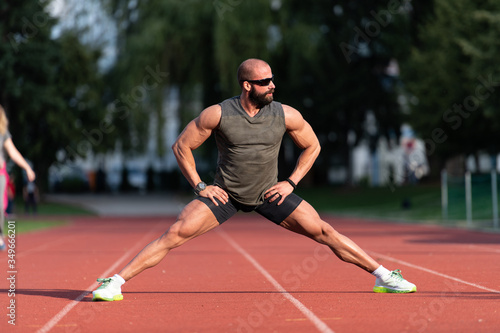 Male Runner Stretching Before Workout