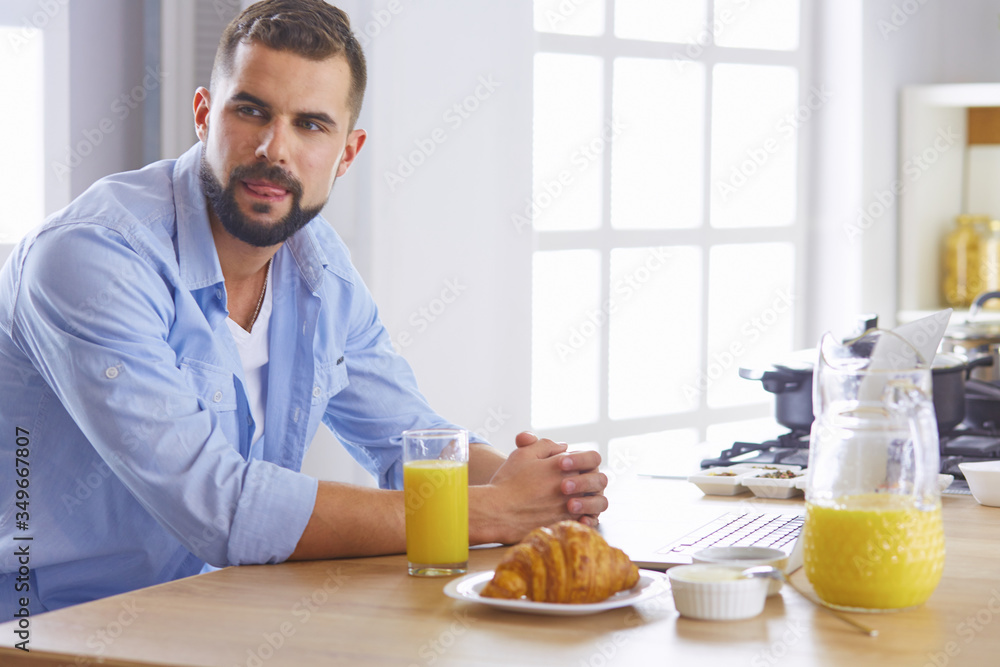a business man breakfasts with notebook and juice a business man breakfasts with notebook and juice