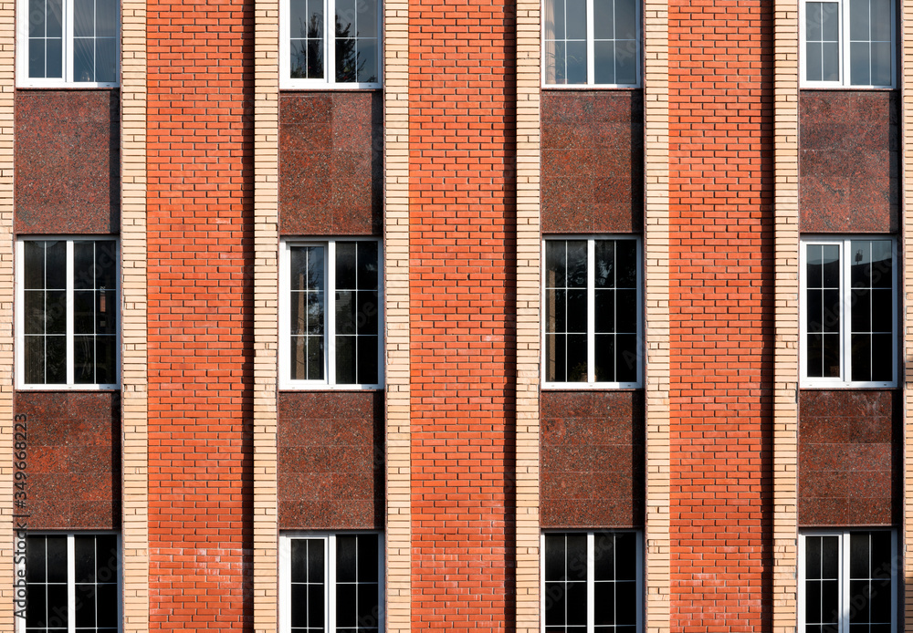 shot of a high rise concrete building with a lot of windows.