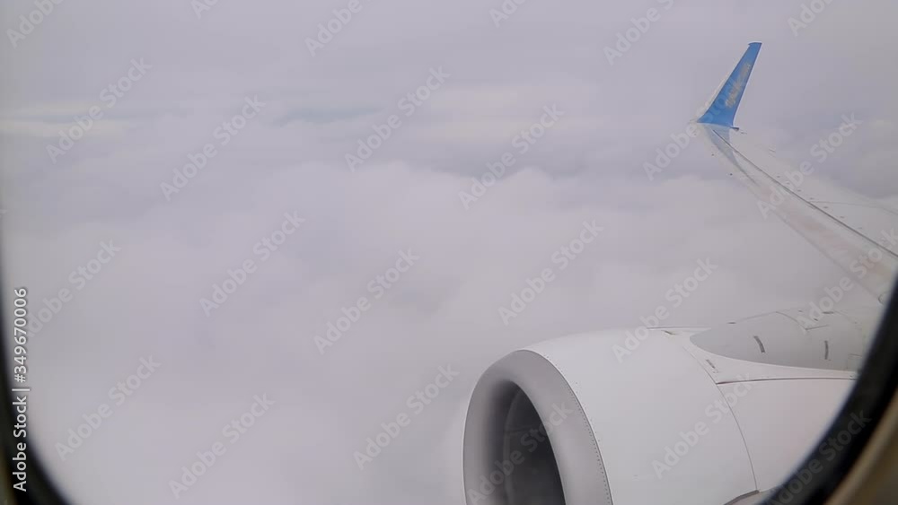 View from the airplane window on the beautiful fluffy clouds. cruising take-off View from the airplane window on the beautiful fluffy clouds. cruising take-off