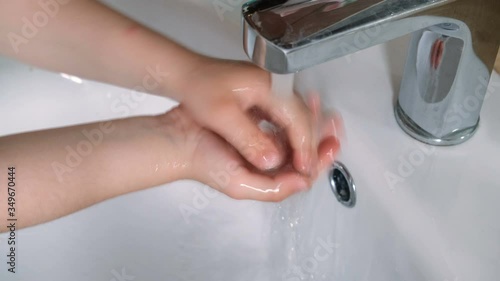 Little child girl Wash hands for covid-19 virus disinfection,family medical care,coronavirus photo