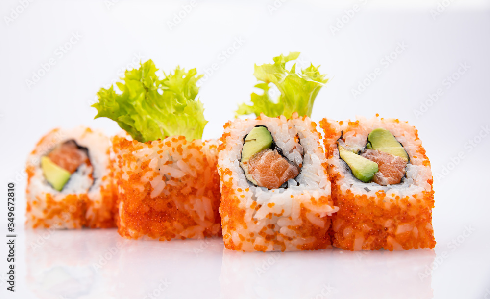 Japanese cuisine. Sushi roll on white background. Japanese cuisine. Sushi roll on white background.