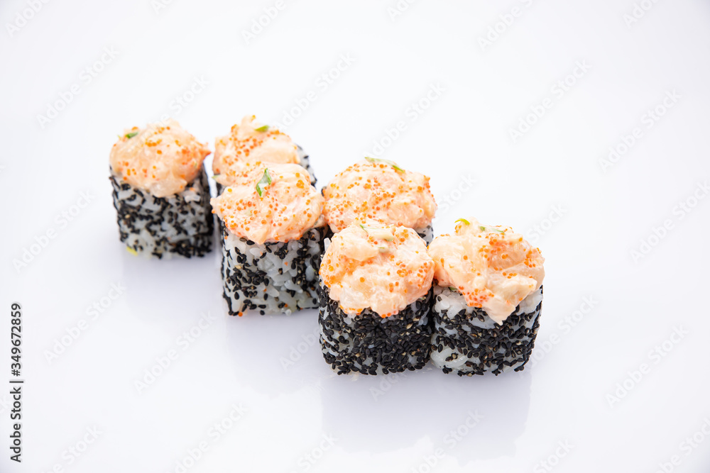 Japanese cuisine. Sushi roll on white background. Japanese cuisine. Sushi roll on white background.