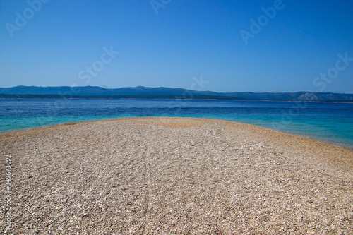 Zlatni Rat sandbar near Bol on the island of Brac in Croatia - Mirror beach on a sand peninsula with turquoise waters in the Adriatic Sea