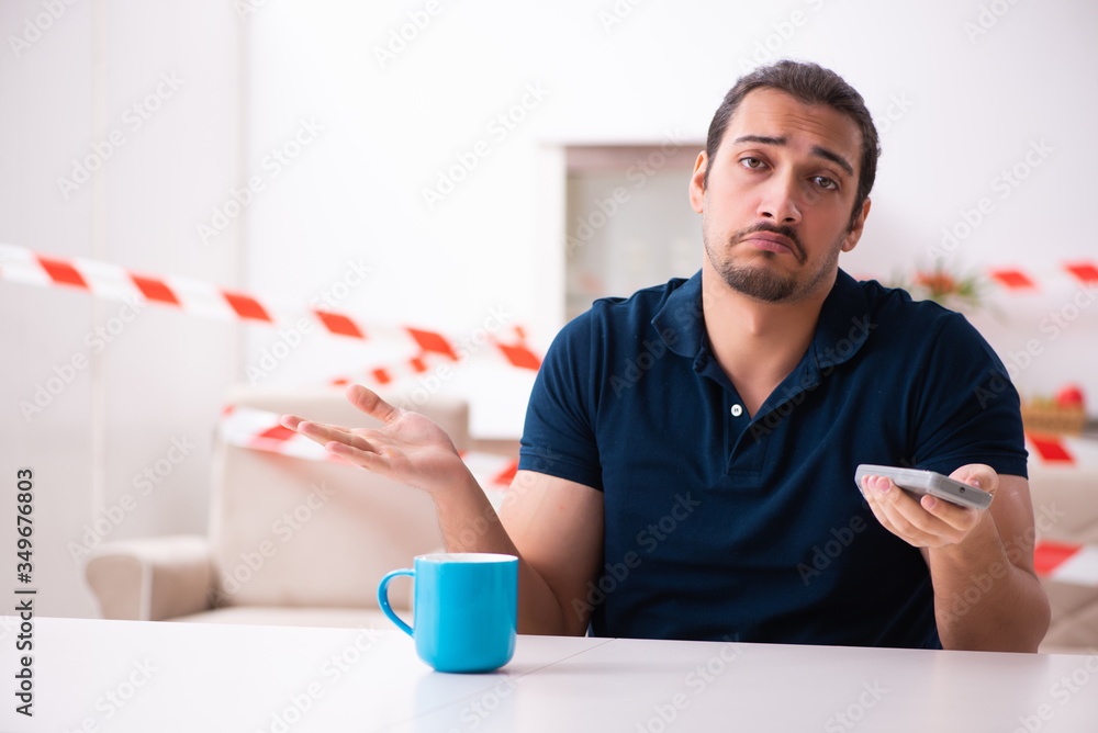 Young man at home in self-isolation concept Young man at home in self-isolation concept