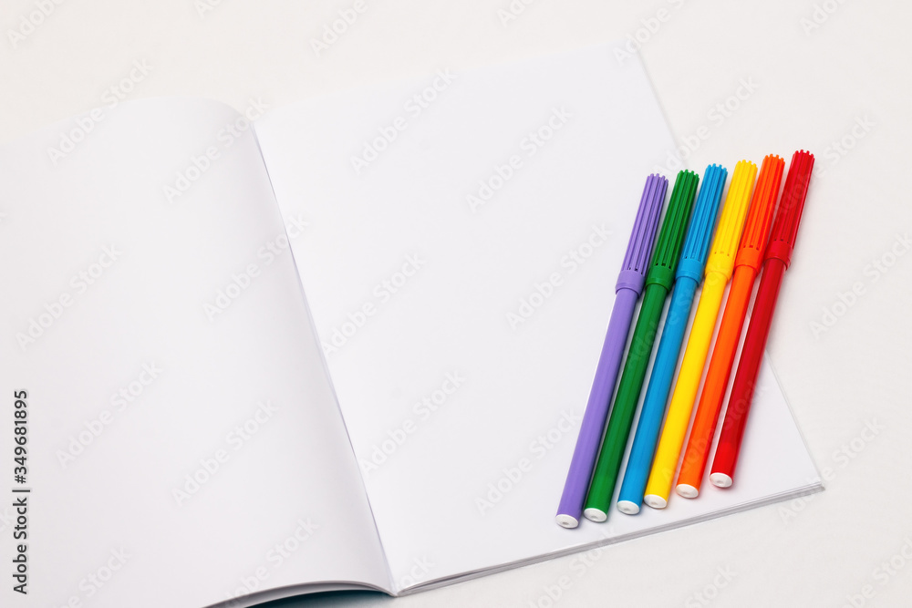 LGBT flag with markers on blank notebook LGBT flag with markers on blank notebook
