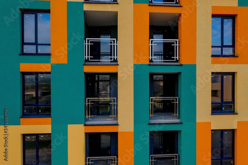 Detail facade with windows. Simple high-rise residential typical building