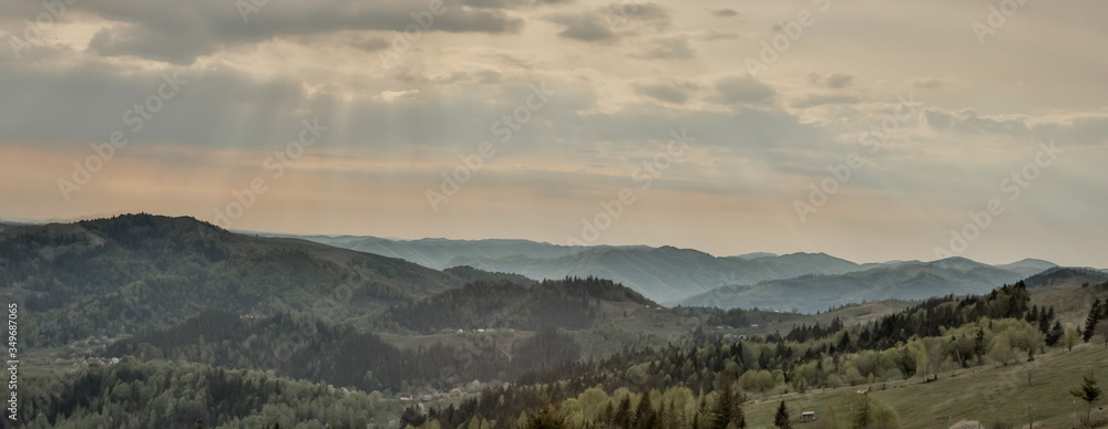 Magnificent panoramic view the coniferous forest on the mighty Carpathians Mountains and beautiful blue sky background. Beauty of wild virgin Ukrainian nature. Peacefulness. Magnificent panoramic view the coniferous forest on the mighty Carpathians Mountains and beautiful blue sky background. Beauty of wild virgin Ukrainian nature. Peacefulness.
