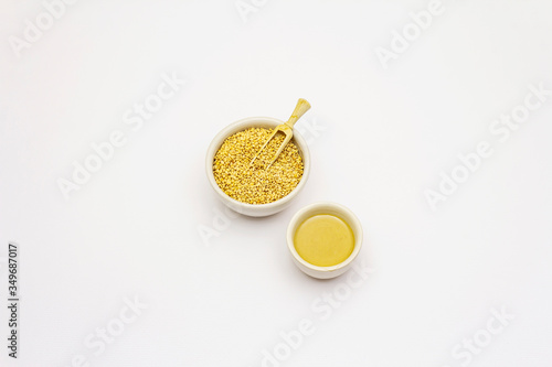 Tahini with sesame seeds isolated on white background