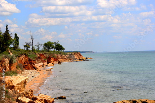 Beautiful wild Beach Fontanka near Odessa. Yellow and red sandstone cliffs are located on the seafront. Sunny day