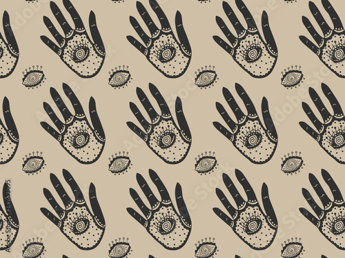 Seamless elegant magic pattern of black ornamental hands with all-seeing eyes inside the palms and the outside on a gold background. Ornament on the theme of providence. Vector.