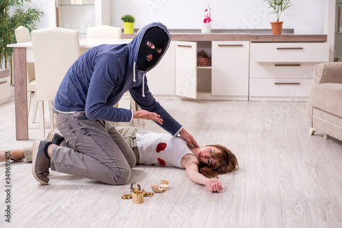 Принти на полотні Gangster and young woman in robbery concept
