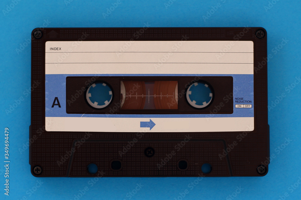 Vintage Cassette tape on a blue background with copy space