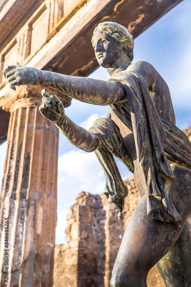 Pompeii in Italy, ruins of the antique Temple of Apollo with bronze Apollo statue, Naples. Stock