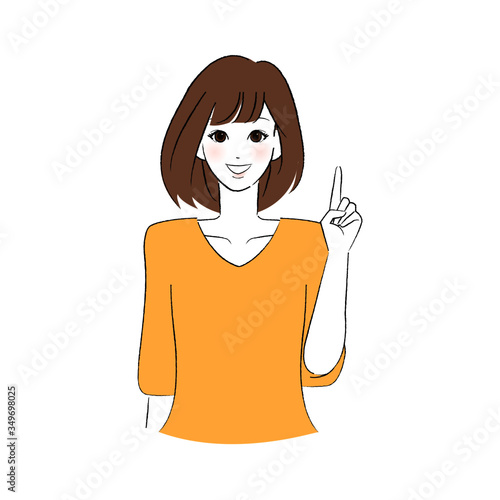 笑顔で指をさす女性