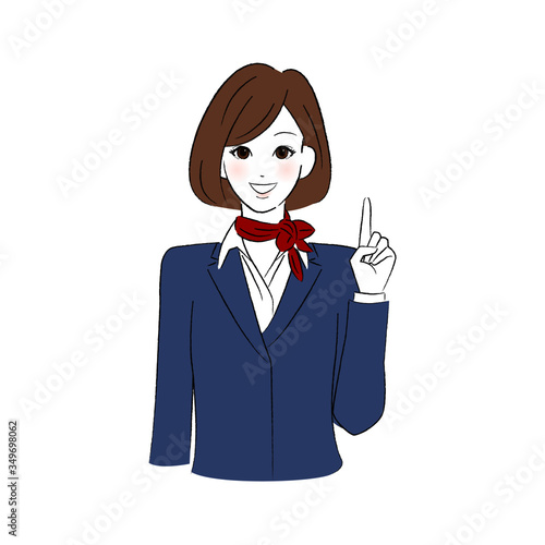 笑顔で指をさす制服を着た女性