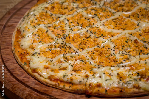 Chicken pizza with catupiry cheese, in Brazil it is called pizza de frango com catupiry photo