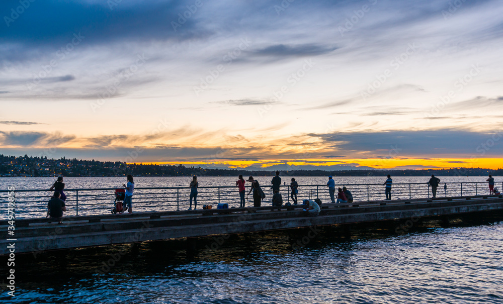 scene of walk way on the lake when sunset.