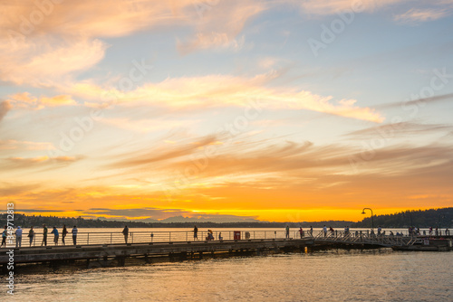 scene of walk way on the lake when sunset.