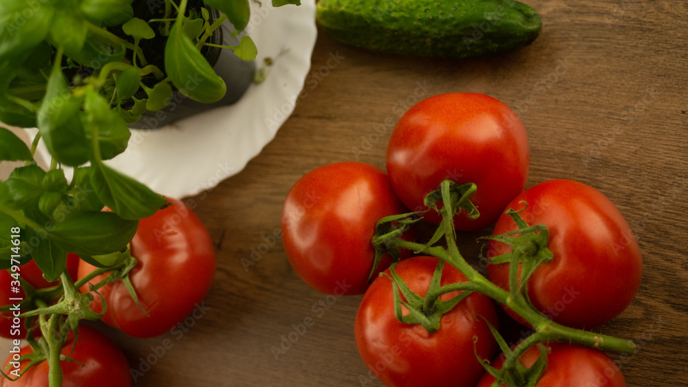 Vegetables. Tomatoes and cucumbers with basil. Ready free entry space
Vegetables. Tomatoes and cucumbers with basil. Ready free entry space