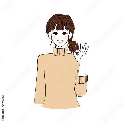 指で丸をつくる女性