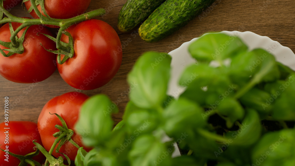 Vegetables. Tomatoes and cucumbers with basil. Ready free entry space
Vegetables. Tomatoes and cucumbers with basil. Ready free entry space