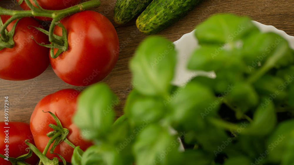 Vegetables. Tomatoes and cucumbers with basil. Ready free entry space
Vegetables. Tomatoes and cucumbers with basil. Ready free entry space
