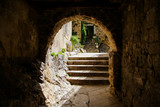 Archway with stone steps in the old town of Omis in Croatia