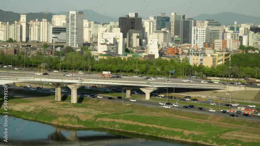 Car traffic at Eungbonggyo Bridge and Seoul freeway near Han river from an elevated point of view Car traffic at Eungbonggyo Bridge and Seoul freeway near Han river from an elevated point of view