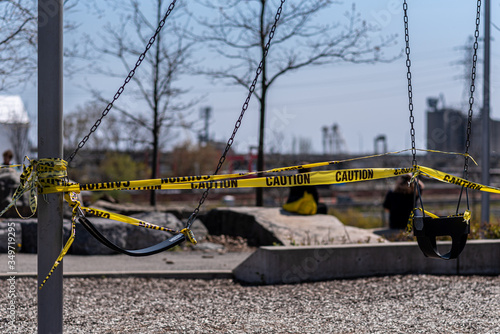 Closed playground in park during COVID lockdown on long weekend in Toronto