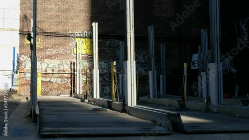 Empty city car lot lifts.