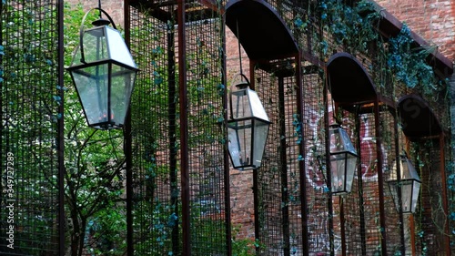 Restaurant lights hang above an outdoor patio.