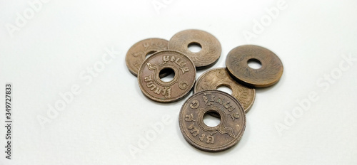 old rusty key,Old coin, Thai pattern, 1929. Price: 1 coin placed on a white background, Thailand