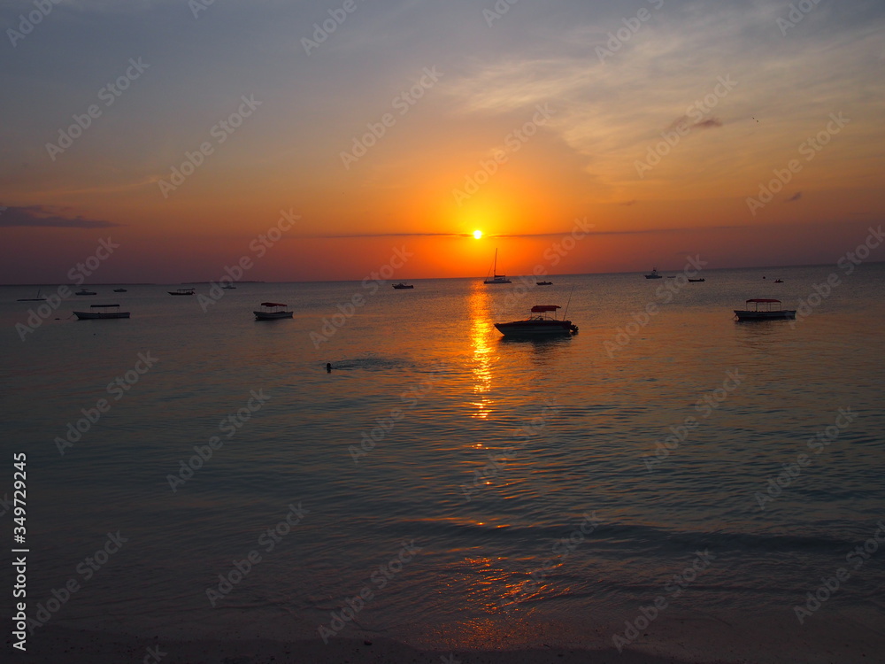 A beautiful sunset with a ship returning to port, Nungwi, Zanzibar, Tanzania