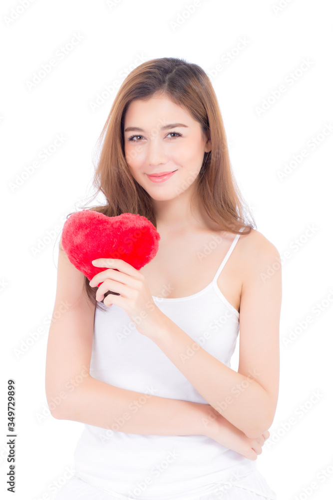 Portrait of beautiful asian young woman holding red heart shape pillow and smile isolated on white background, valentines day, holiday concept. Portrait of beautiful asian young woman holding red heart shape pillow and smile isolated on white background, valentines day, holiday concept.