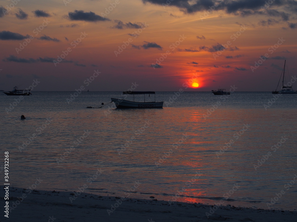Beautiful sunset with a ship returning to port, Nungwi, Zanzibar, Tanzania
