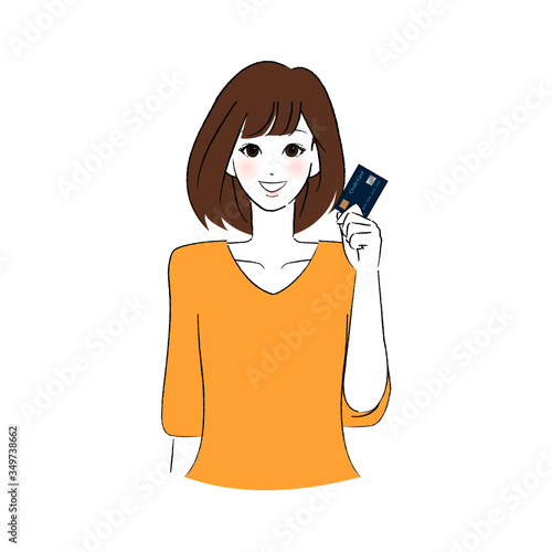 キャッシュカードを持つ女性