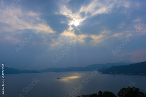 sun ray over Sun Moon Lake, view from Wen Wu Temple viewpoint © uppichaya
